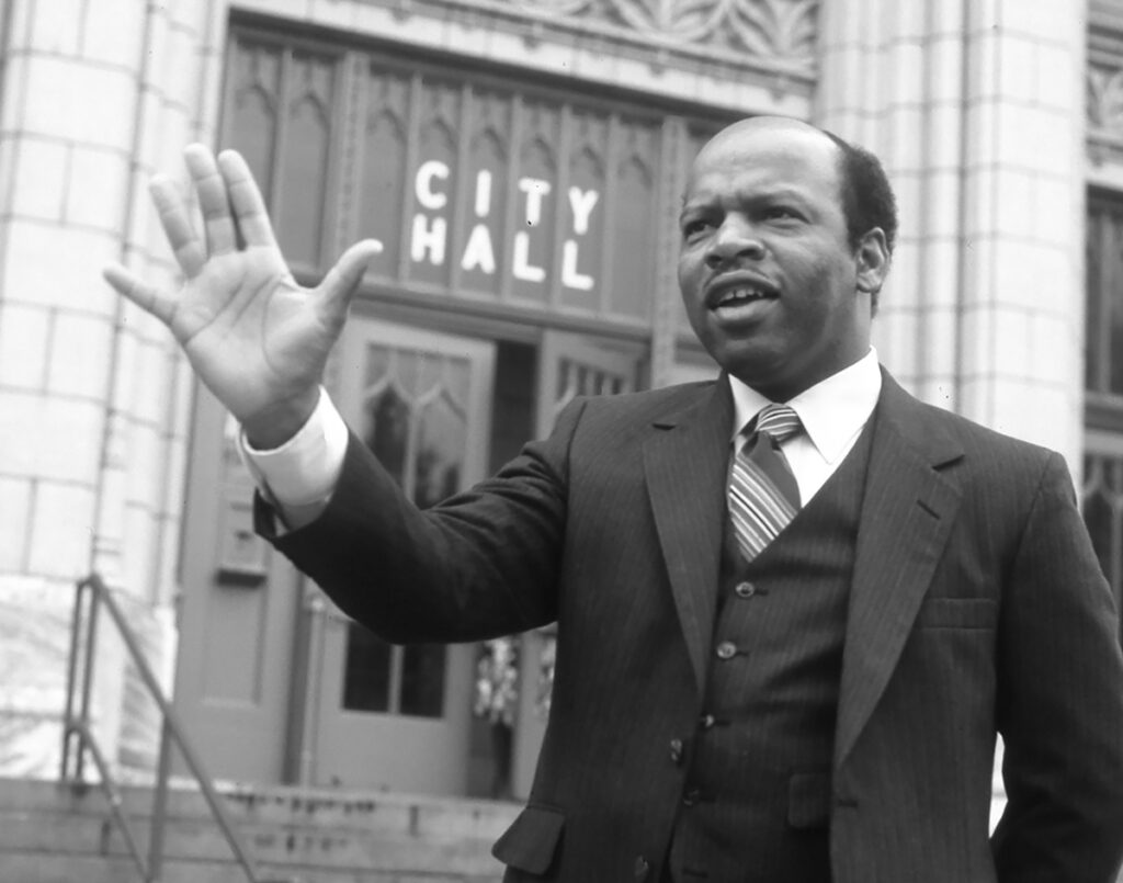 Then-Atlanta city council member John Lewis speaks outside Atlanta City Hall on October 11,1982.
